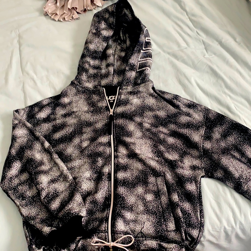 This is a black, metallic Ugg zip up jacket size M